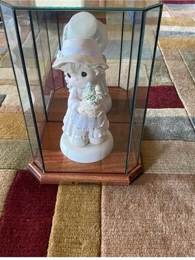 LIMITED EDITION. RETIRED. PRECIOUS MOMENTS LOVE GROWS HERE.